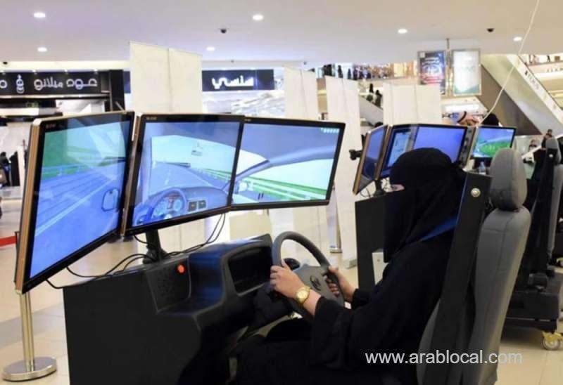 woman-tries-a-driving-simulator-installed-at-a-mall-in-madinah--saudi