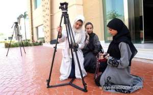 student-sama-kinsara-adjusts-her-camera-at-saudi-arabia’s-only-cinema-school,_UAE
